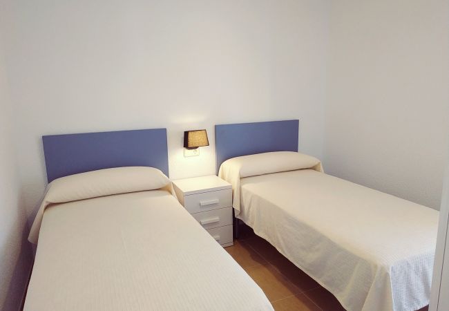 Chambre double avec deux lits simples